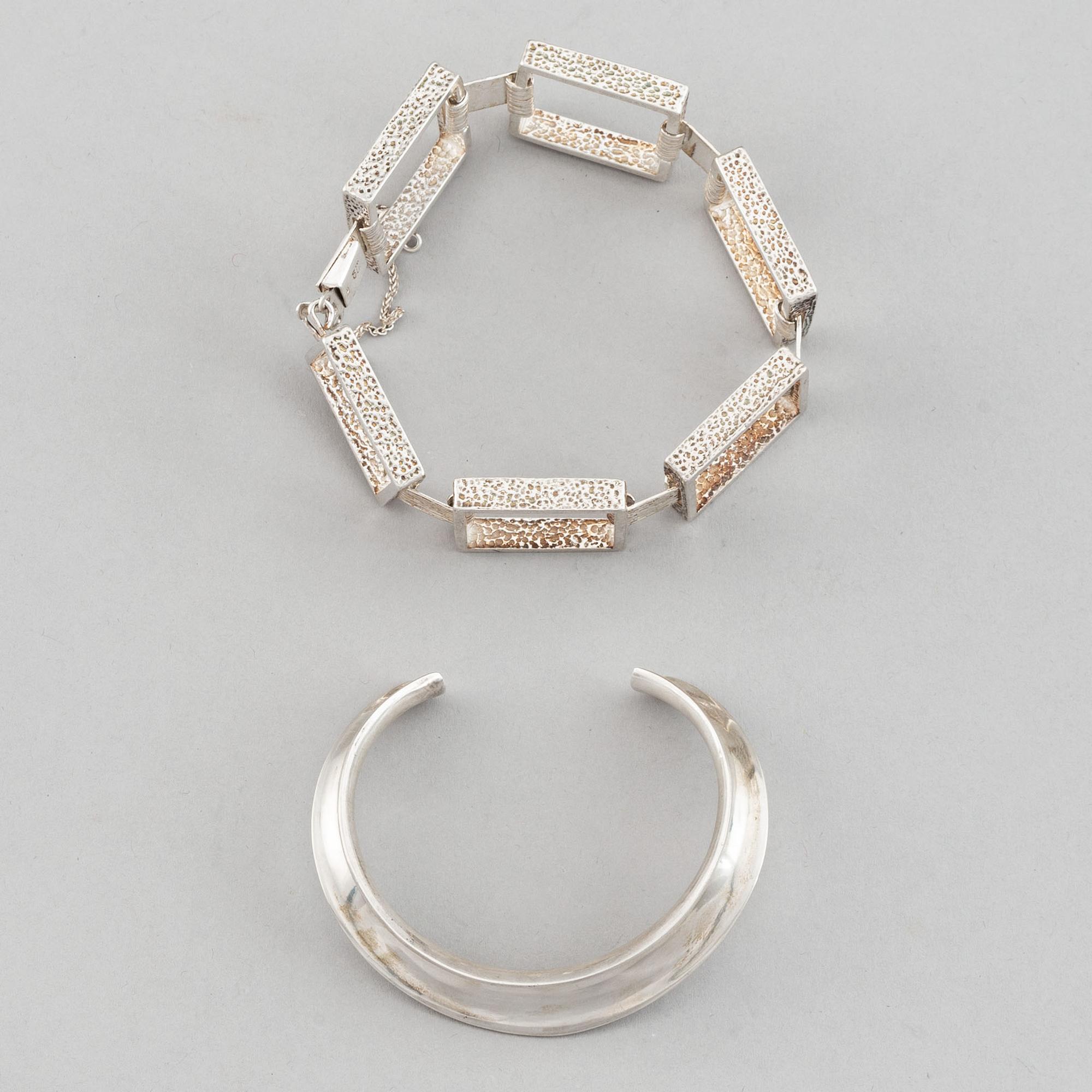 Two silver bracelets, including Denmark.