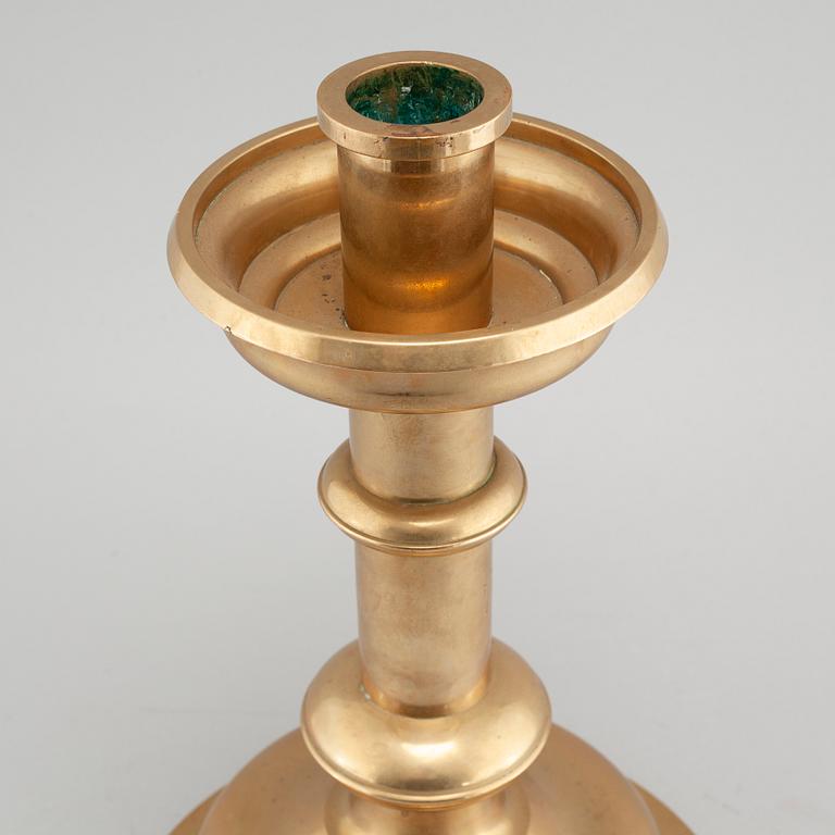 A brass candlestick by Erik Jonsson, Skara from the second half of the 20th century.