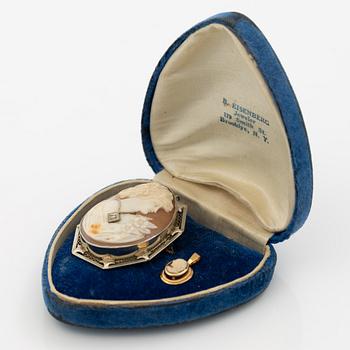 Brooch/pendant, 14K white gold and pendant in 18K gold, both with shell cameos, one with a small diamond.