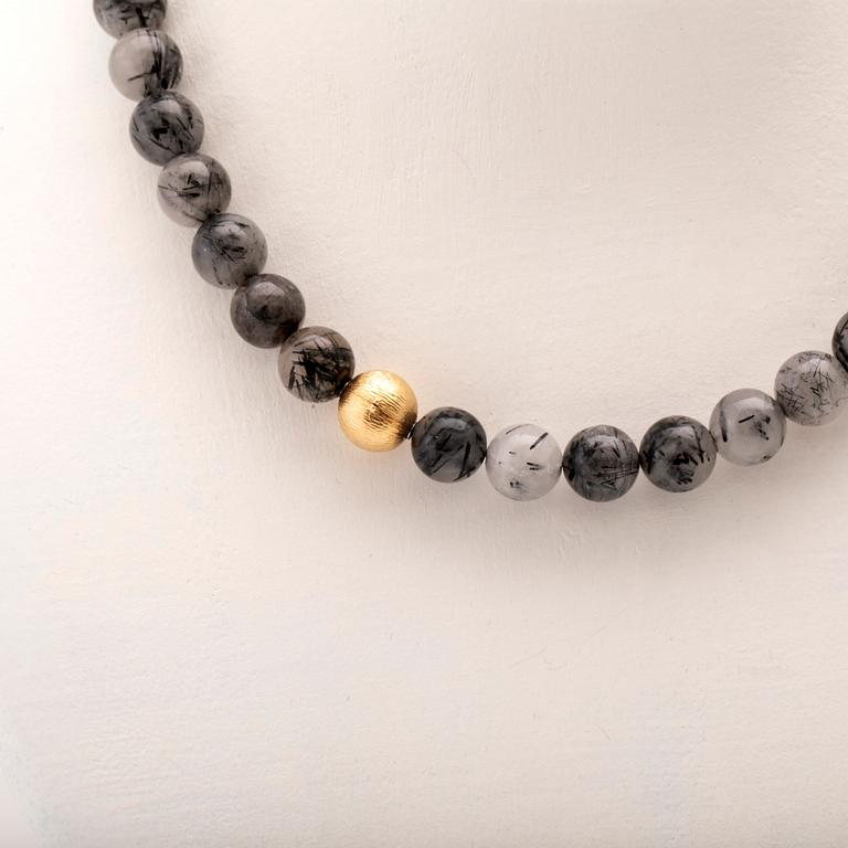 Ole Lynggaard, two necklaces and clasp in 18K gold.