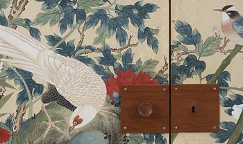 A Josef Frank mahogany cabinet, the sides and doors covered in handpainted wallpaper, Svenskt Tenn, circa 1950.