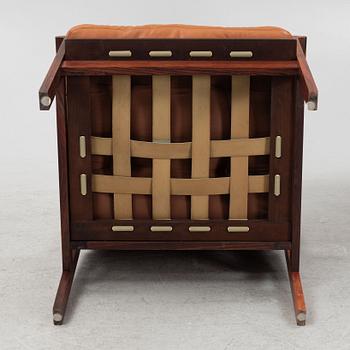 Illum Wikkelsö, a pair of 'Capella' armchairs and an ottoman, second half of the 20th century.