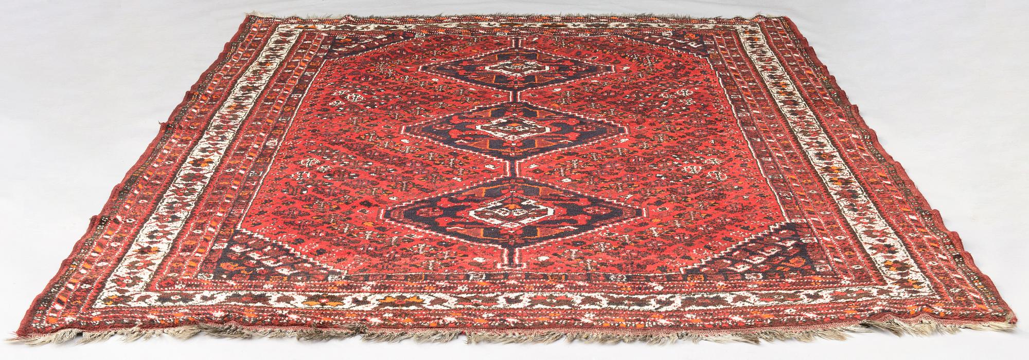 A oriental  carpet. Ca 220x320 cm.