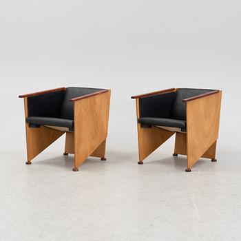 Torbjörn Ahlström, a pair of mahogany and cherry armchairs.