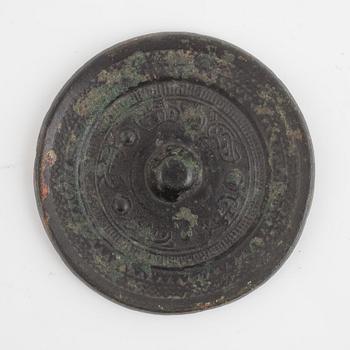 A Chinese bronze mirror, Han dynasty (206 BC-220 AD).