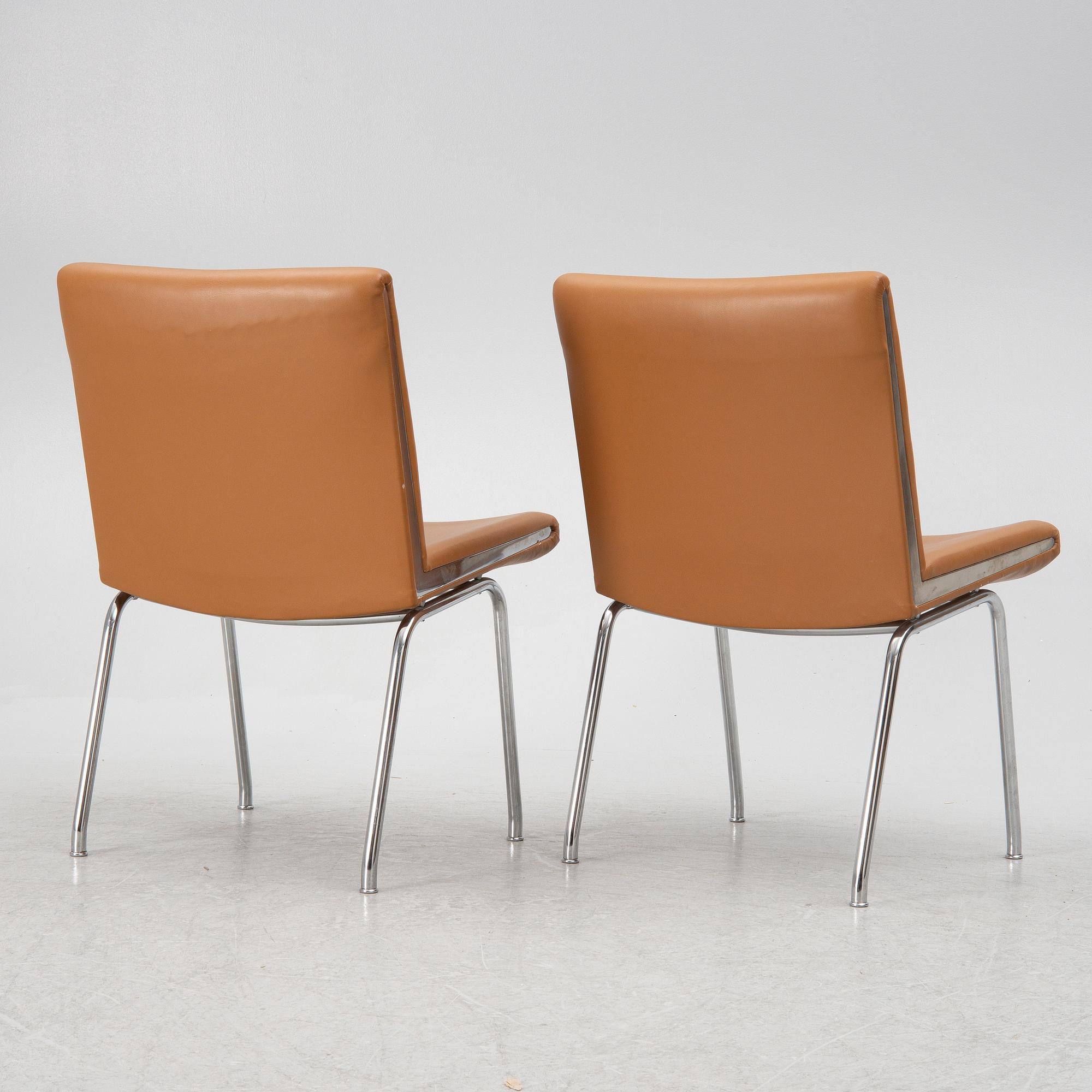 Hans J. Wegner, a pair pf "Kastrup Airport" lounge chairs, Denmark, late 20th century.