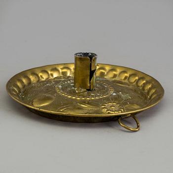 A BRASS CANDLESTICK and a GRATER, 18th century.