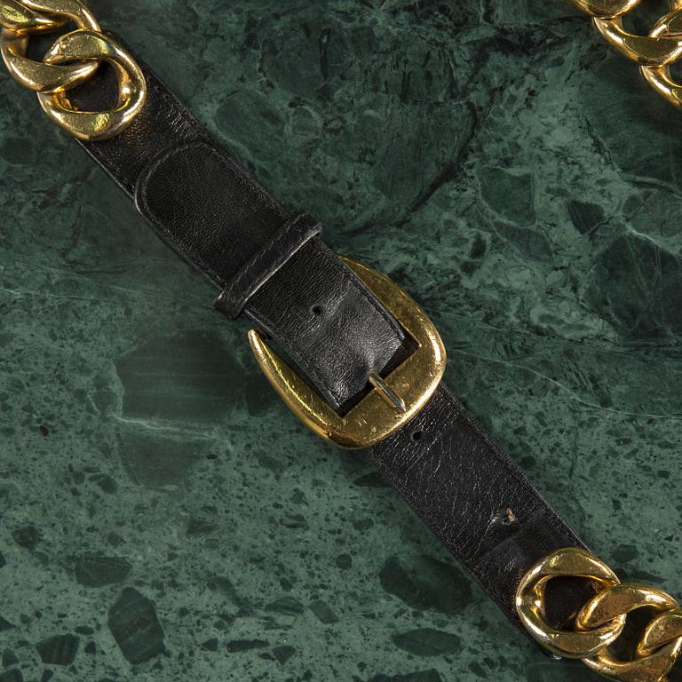 Belt by Chanel.