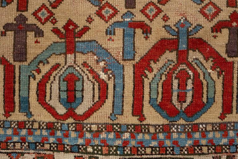 A rug, antique Anatolian/Caucasian, ca 148-149 x 104,5-110 cm (as well as 1-1,5 cm flat weave at one end).