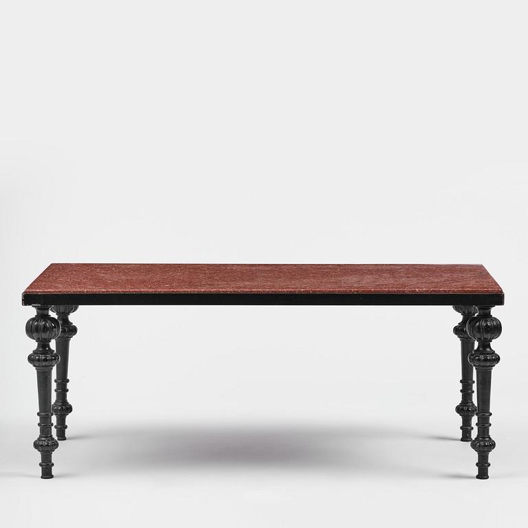 A table with granite stone top from Älvdalen, first part 19th century on a later metal stand.