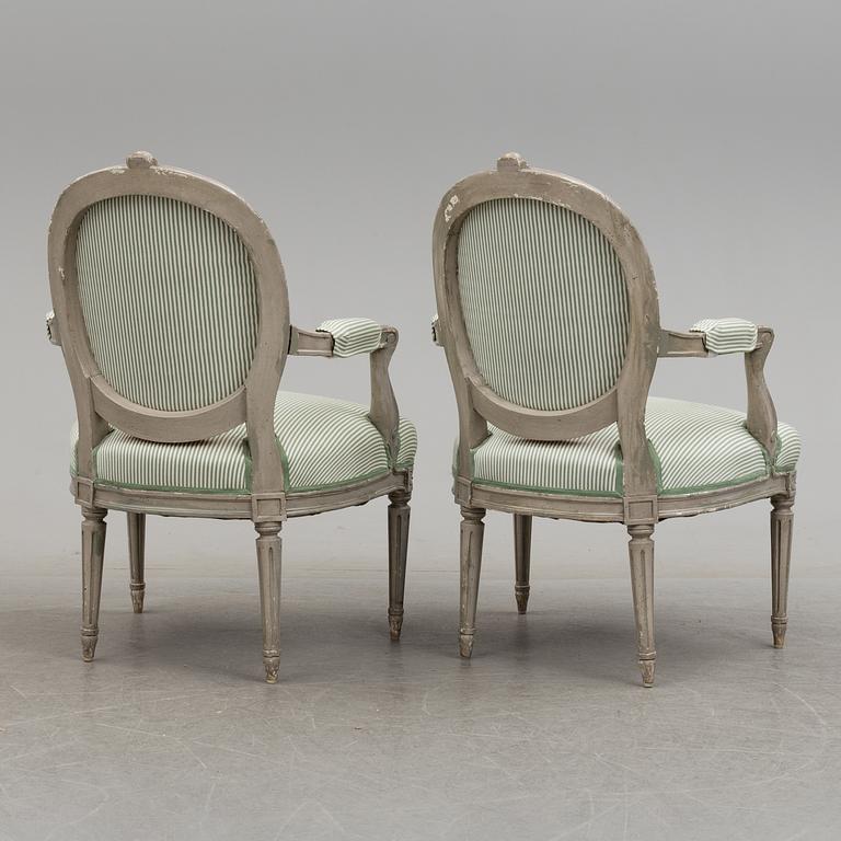 A pair of Gustavian style armchairs, 20th century.