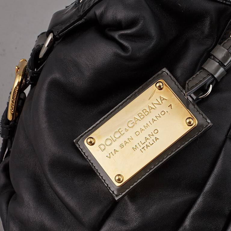 DOLCE & GABBANA, a black leather bag.