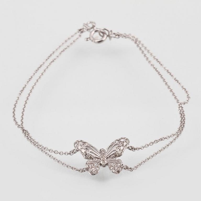 ARMBAND, 18K vitguld med briljantslipade diamanter ca 0.36 ct. Vikt 2,7 gram.
