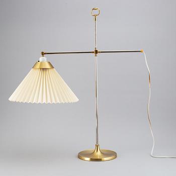 Le Klint, a brass adjustable T210 table light, Denmark.