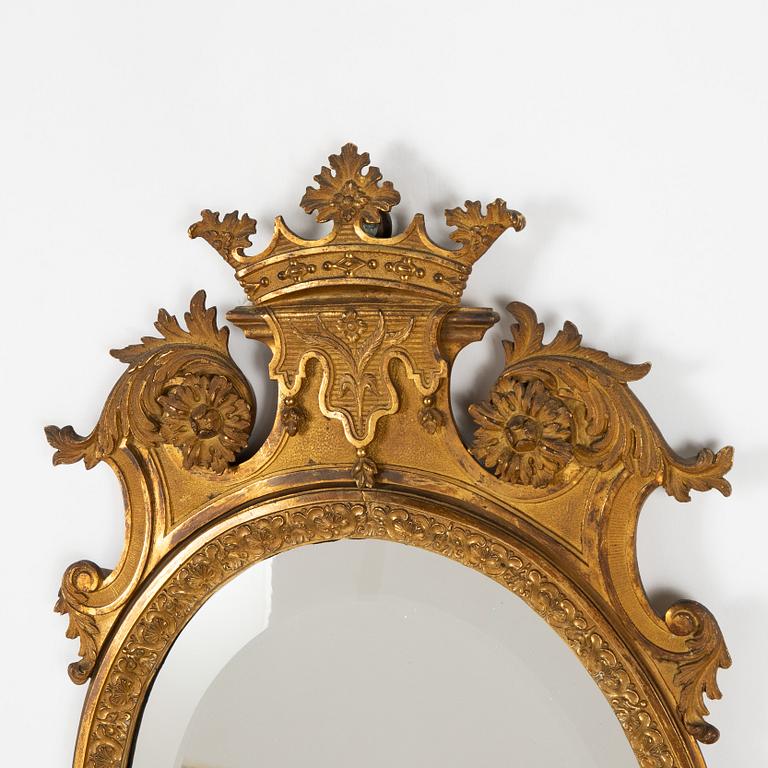 A pair of French Louis XIV-style ormolu two-light girandoles, after a model by Daniel Marot (1661-1752).