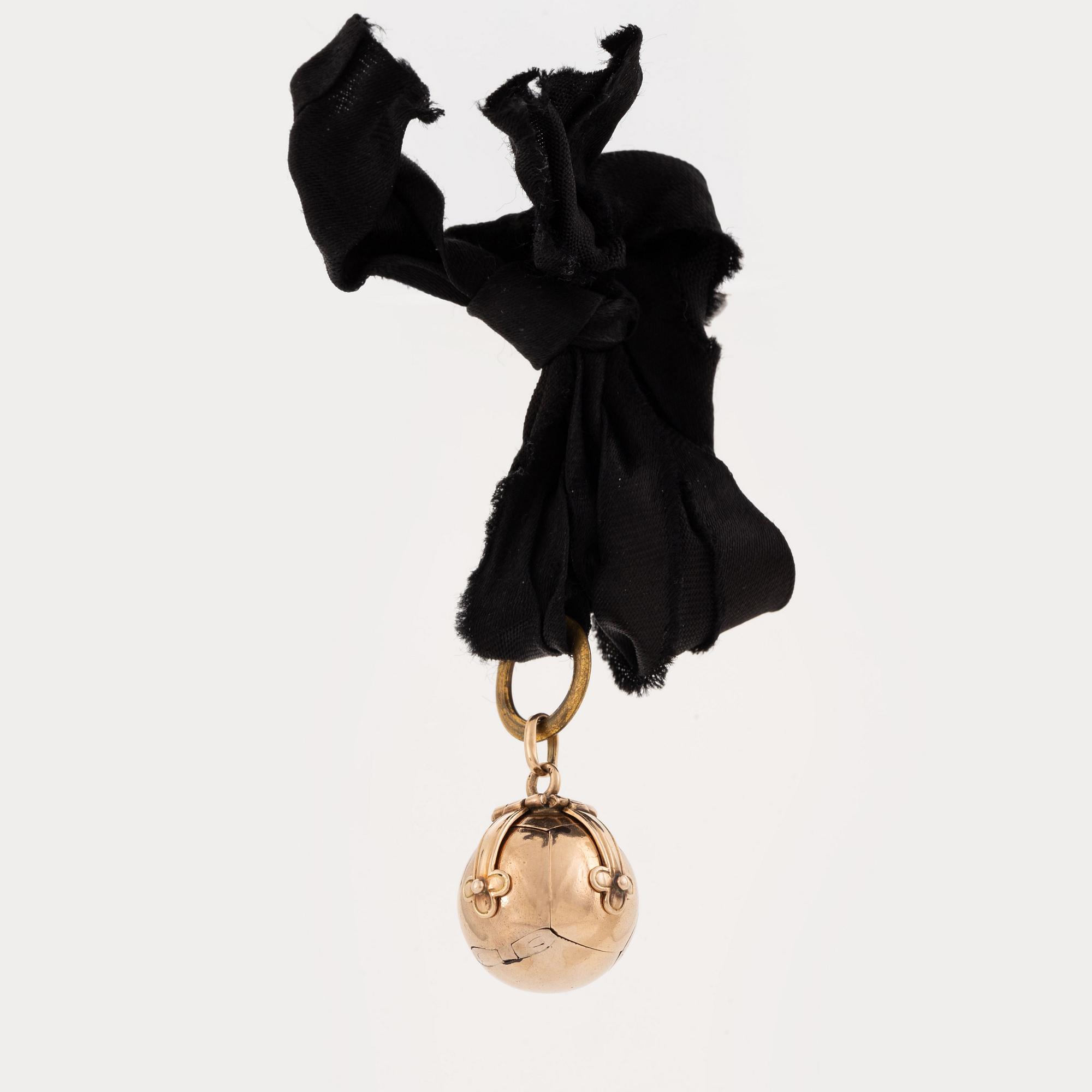 A round freemason pendant.