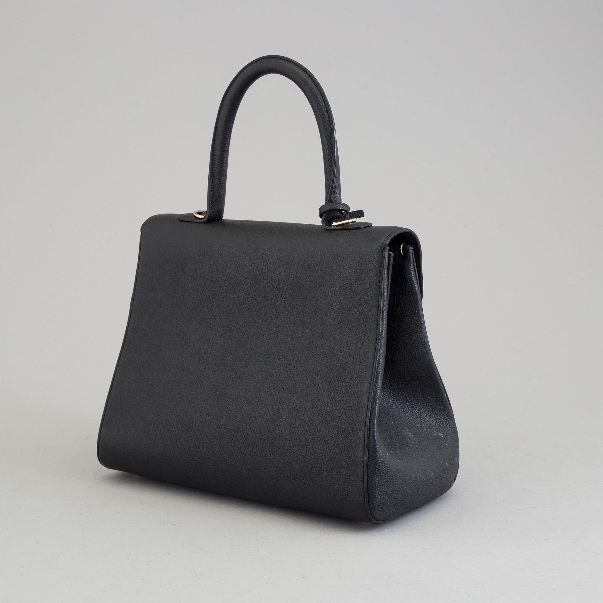A Delvaux "Brillant" ladies handbag in black colored leather.