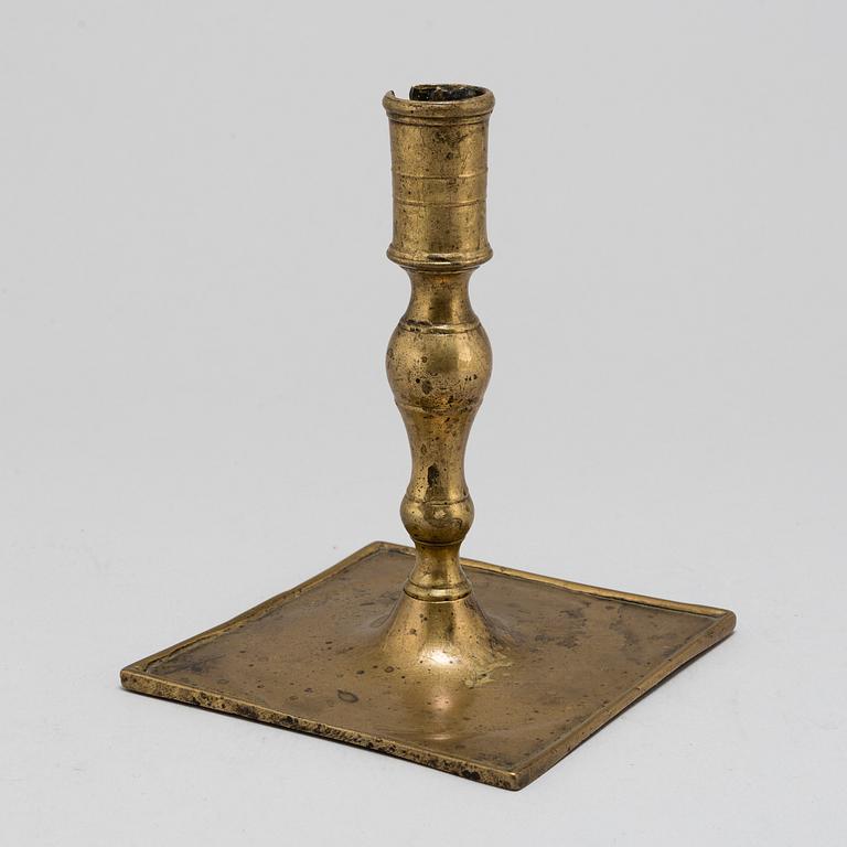 A Baroque brass candlestick, early 18th century.