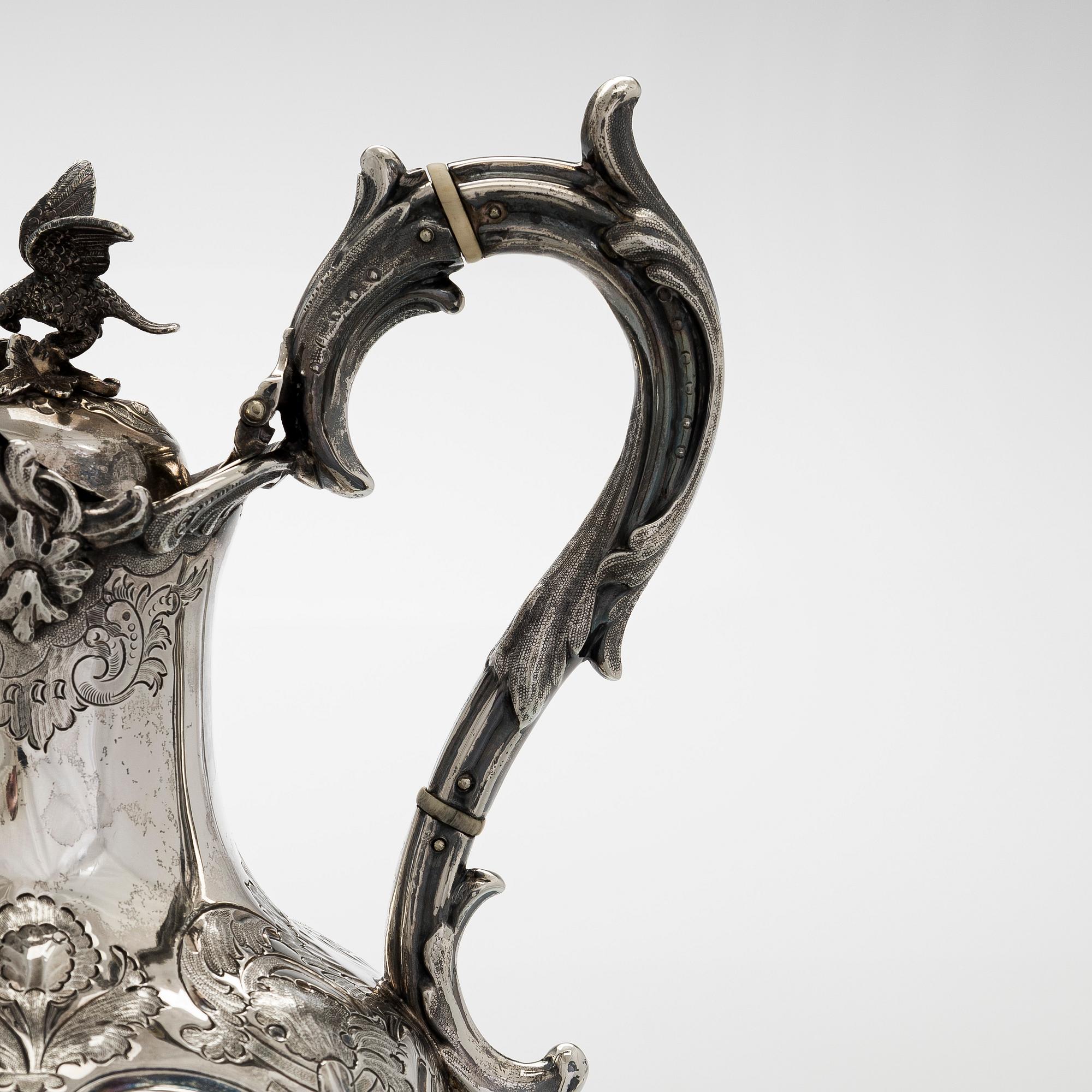 A sterling silver jug, maker's mark of Martin, Hall & Co, Sheffield 1877.