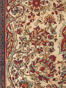 A carpet, an antique Kerman Laver, ca 677-688,5 x 510,5-526 cm.