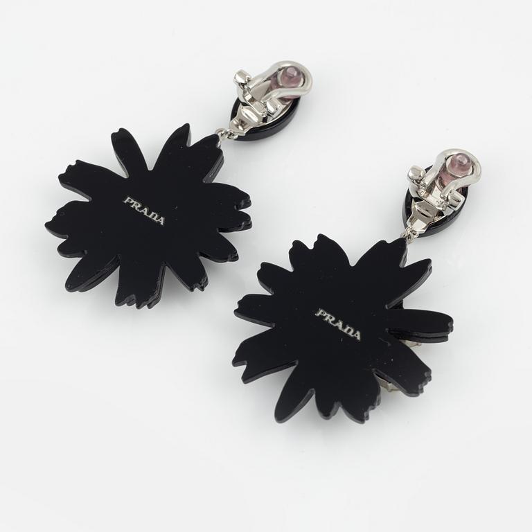 Prada, a pair of clip-on earrings.