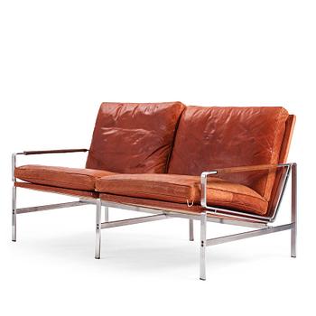 538. Preben Fabricius & Jørgen Kastholm, a two-seated brown leather sofa, Kill International, Germany 1960s.