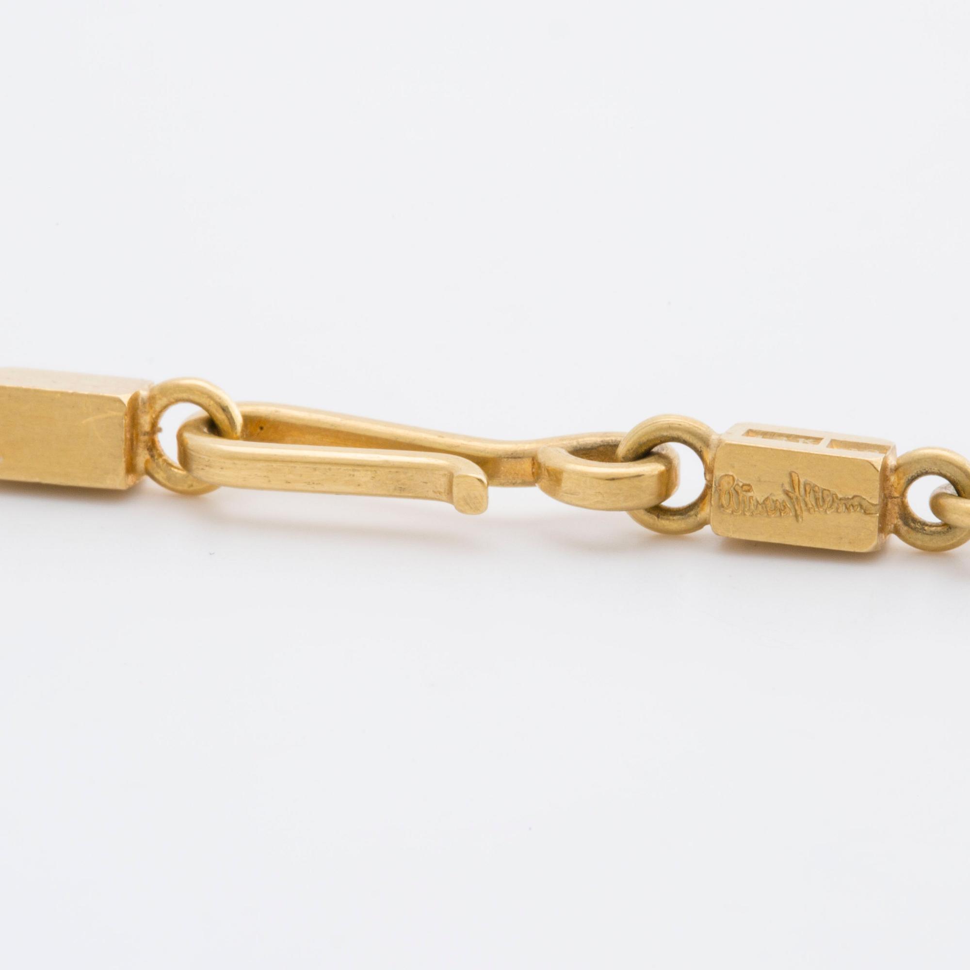WIWEN NILSSON COLLIER 18K guld mindre stavar och ringar, Lund 1970, original etui.