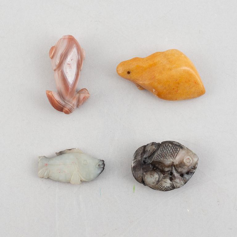 A group of eight Chinese stone charms / pendants, 20th century.