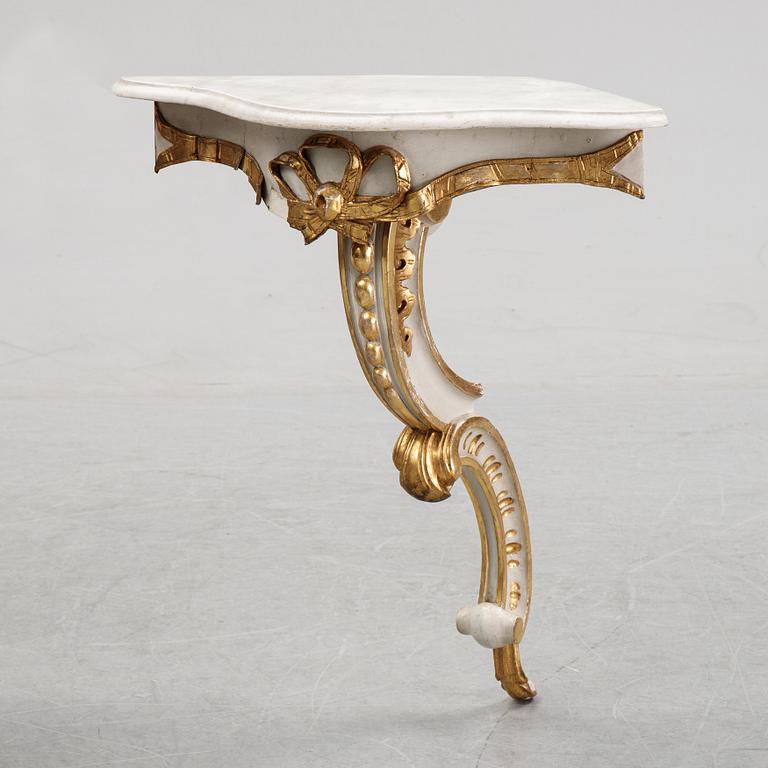 A samll console table for a corner with a wooden top.