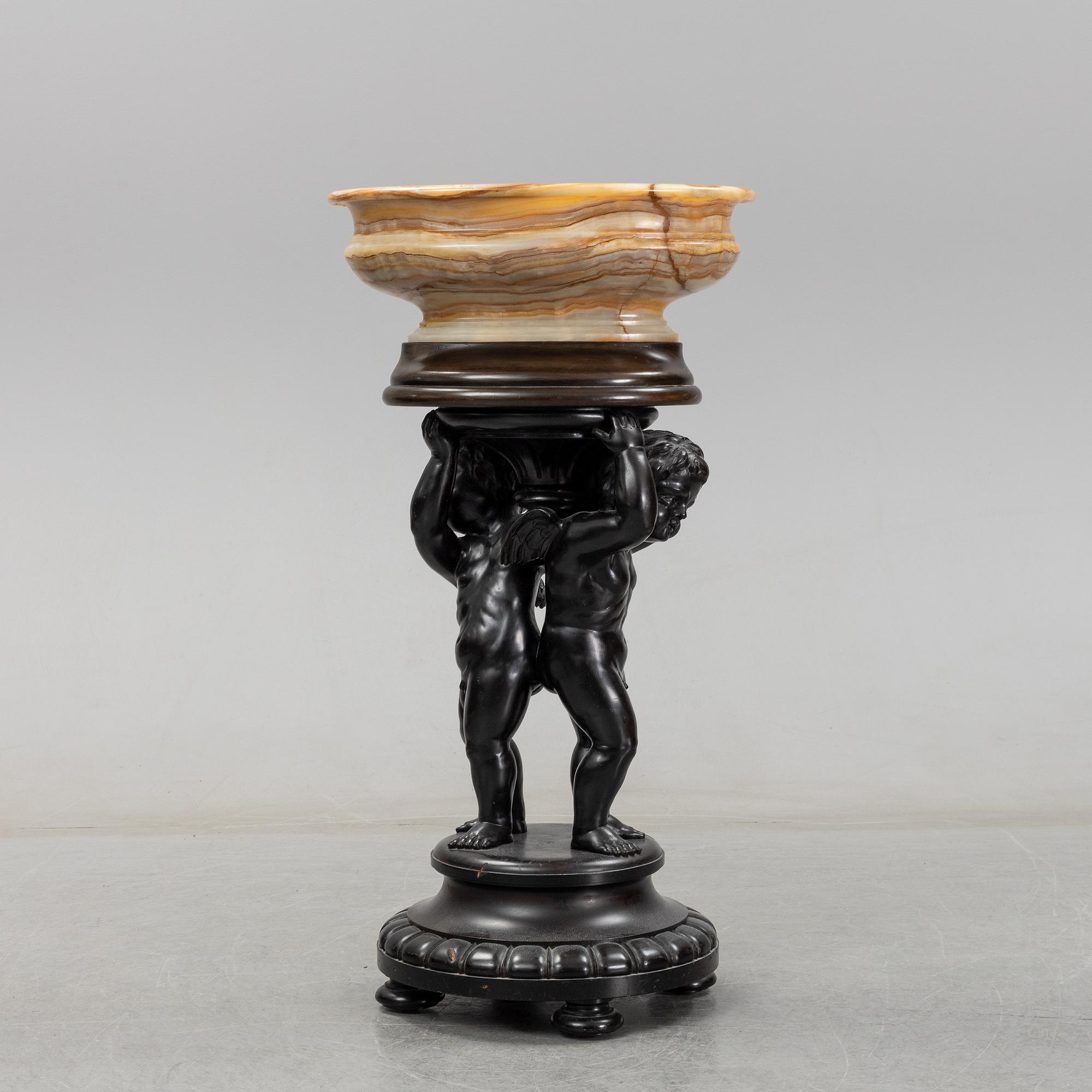 A wooden pedestal with onyx bowl, 20th Century.