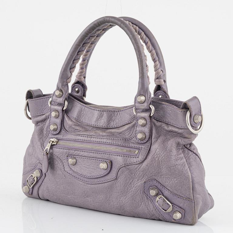 Balenciaga, a purple leather 'City' handbag.