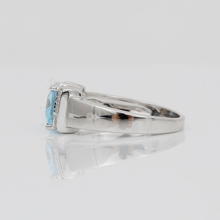RING, 14K vitguld med smaragslipad topas ca 2,51 ct och  små åttkantslipade diamanter ca 0,04 ct. Vikt ca 3,89 g.