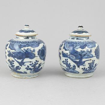 A pair of Chinese blue and white jars with covers, and one jar, Ming dynasty (1368-1644).