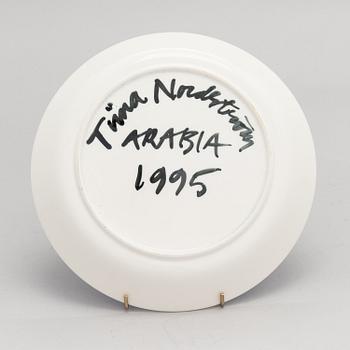 Tiina Nordström, a porcelain decorative plate, signed Tiina Nordström Arabia 1995.
