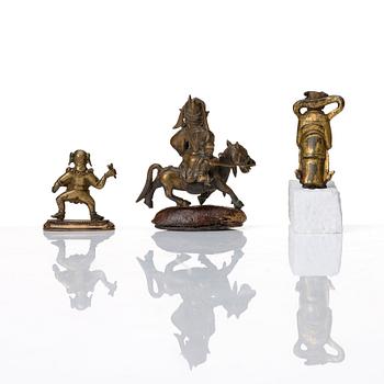 A group of three bronze miniatures sculptures of deities, China and Tibet, 18th Century.