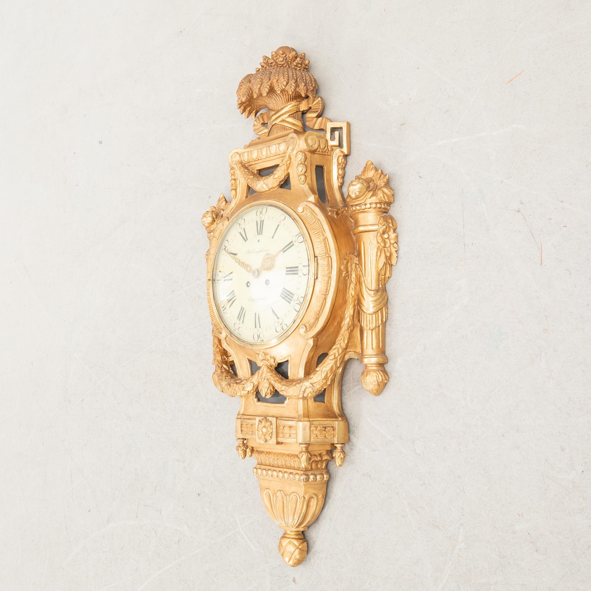 Wall clock in the Gustavian style, first half of the 20th century.