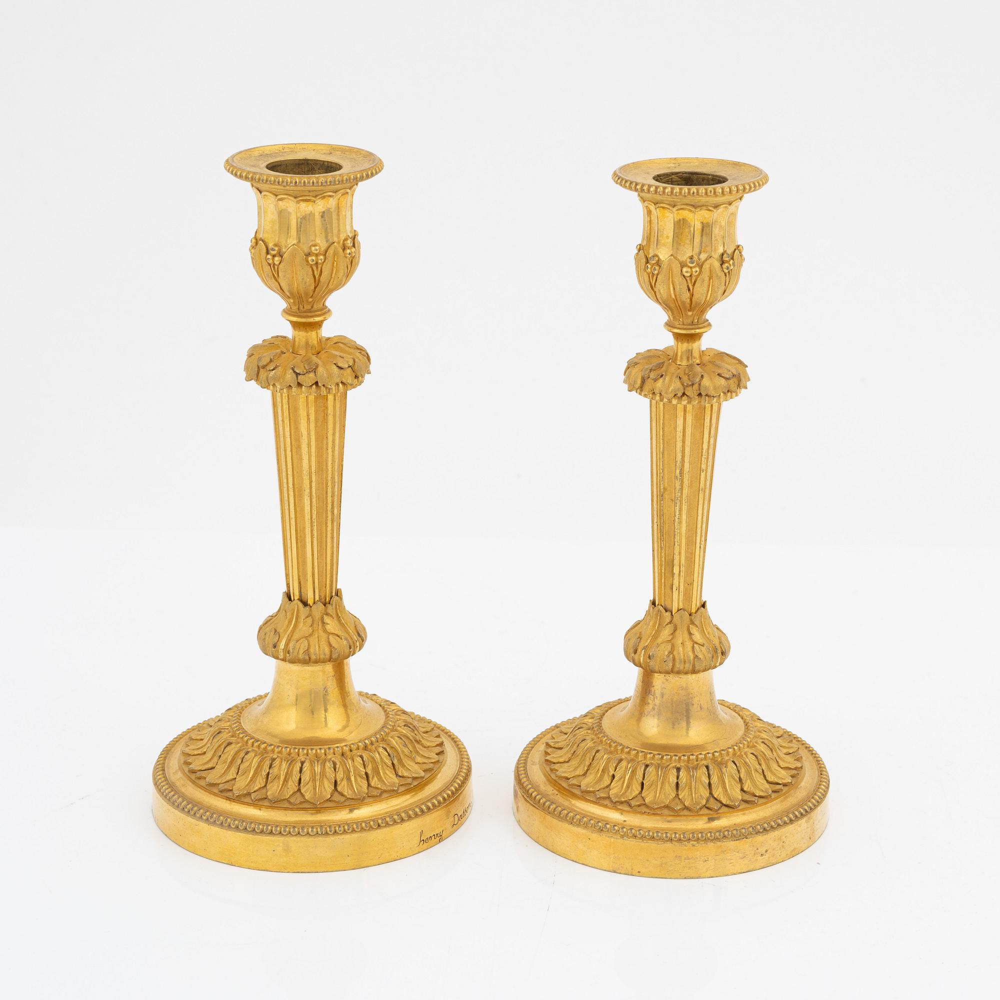 A pair of gilded bronze candelsticks, 19th Century.