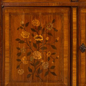 A French Louis XVI-style cupboard, ca 1900.