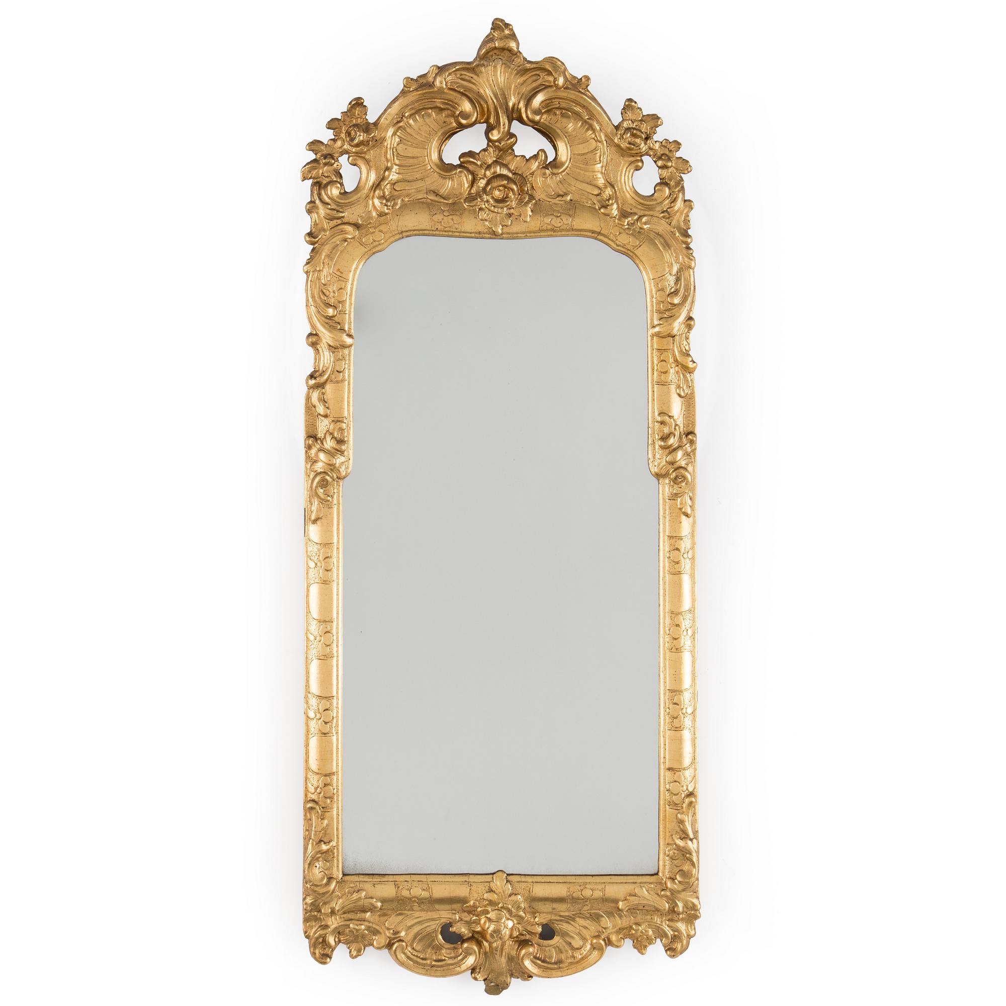 A Rococo mirror, 18th century.