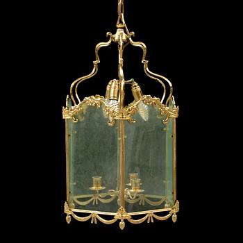 A brass ceiling light "Jubileumslyktan" by K.A. Jonsson, signed and dated 2002.