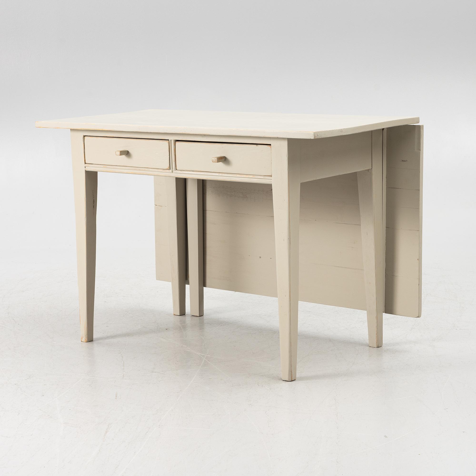 A drop-leaf table, late 19th century.