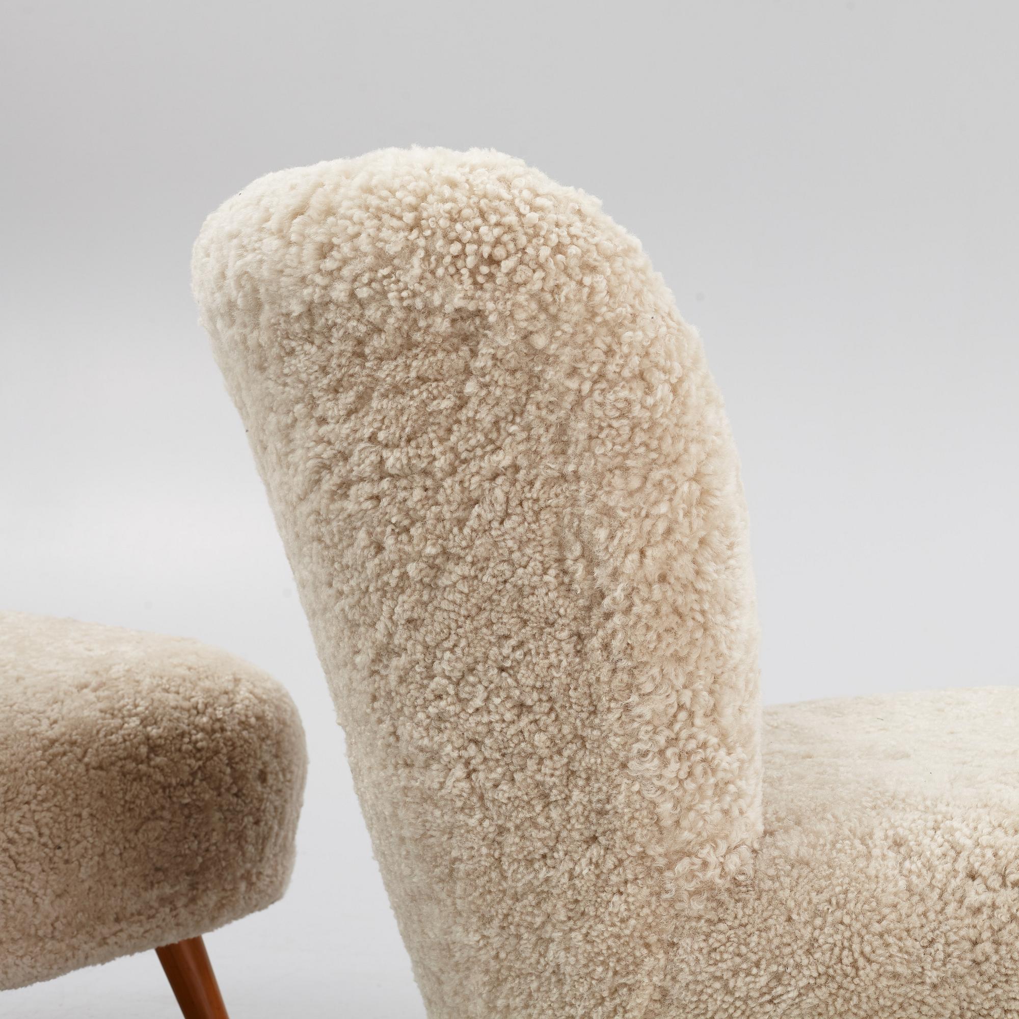 A pair of mid 20th Century easy chairs.