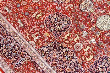 A pictoral orietal silk rug, 246 x 153 cm.