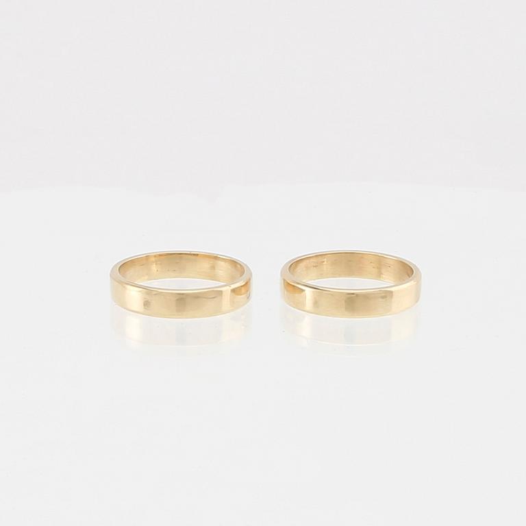 Wiwen Nilsson, a pair of 18K gold rings with a box shaped like a hymn book, Lund 1970.