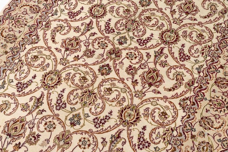 An Isfahan, part silk rug, signed, c. 165 x 112 cm.