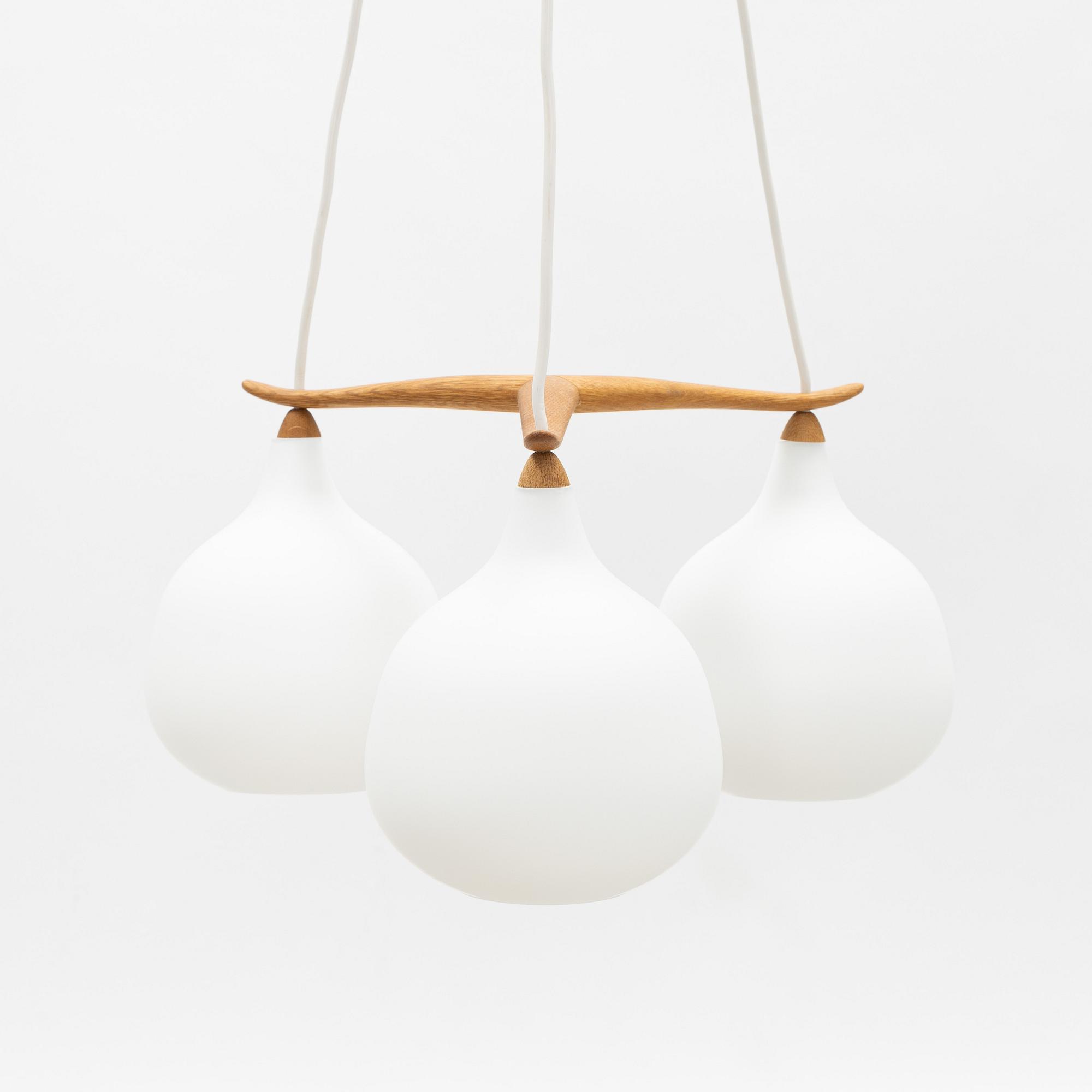 Uno & Östen Kristiansson, an oak and glass three-light ceiling lamp, Luxus, Vittsjö.