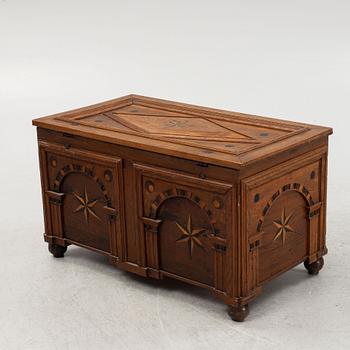 A Baroque style oak chest, end of the 19th Century with older parts.