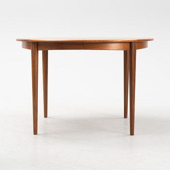 A teak and walnut dining table, second half of the 20th Century.