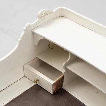 A painted rococo writing desk, mid 18th Century with later parts.