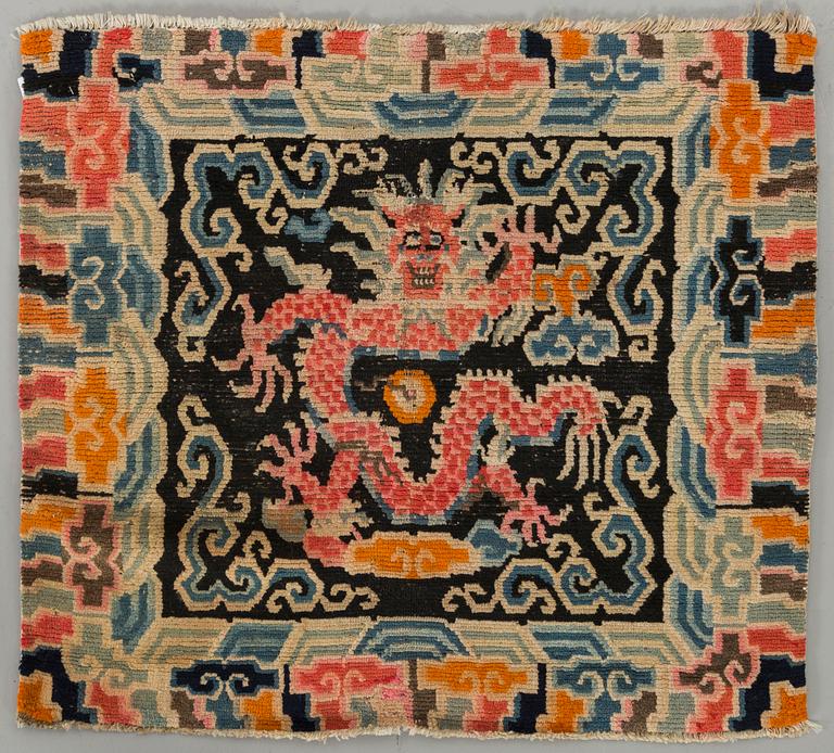 A semiantique Tibetan carpet ca 71 x 79 cm.